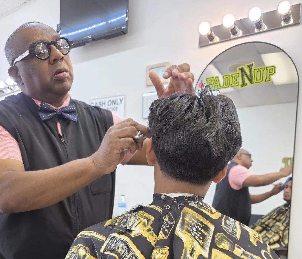 Barber giving a haircut at Fade N Up in Knightdale NC